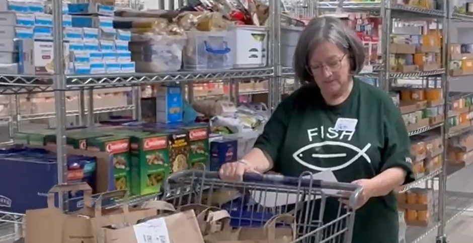 PattiC_Pantry loading Volunteer filling food order in Food Pantry